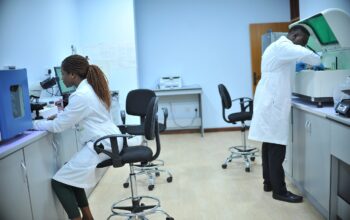 group of diverse young scientists in lab coats