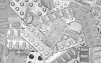 modern pills and tablet on a digital background