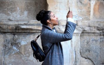 person using smartphone with nature background