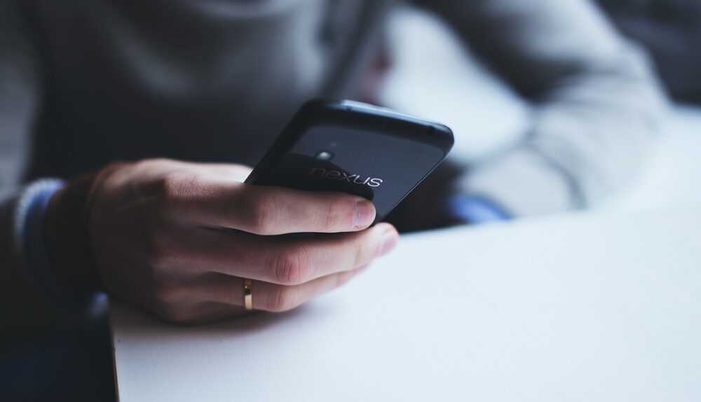 smartphones with ai logos