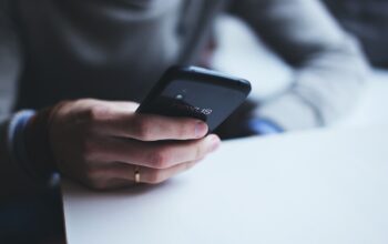 smartphones with ai logos