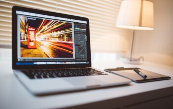 compliance documents, digital devices, office setting