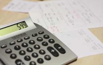 newspaper with calculator