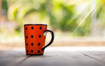 podcast microphones and coffee mugs