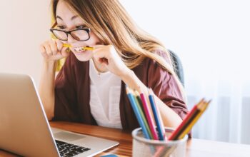 happy employee at laptop desk