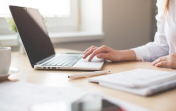 laptop on desk, professional setting, workspace