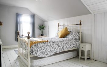 cozy bedroom with natural light and wooden furniture