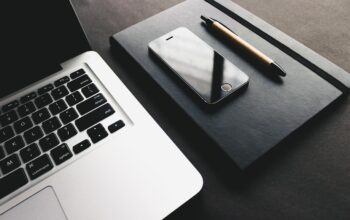 sleek silver laptop on modern desk with city background